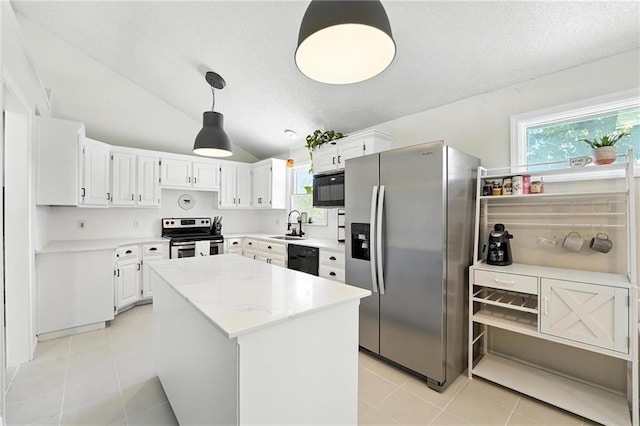 2903 E 107th Ter, Kansas City, MO 64137 - kitchen with black appliances, light tile patterned floors, plenty of natural light, vaulted ceiling, and a textured ceiling
