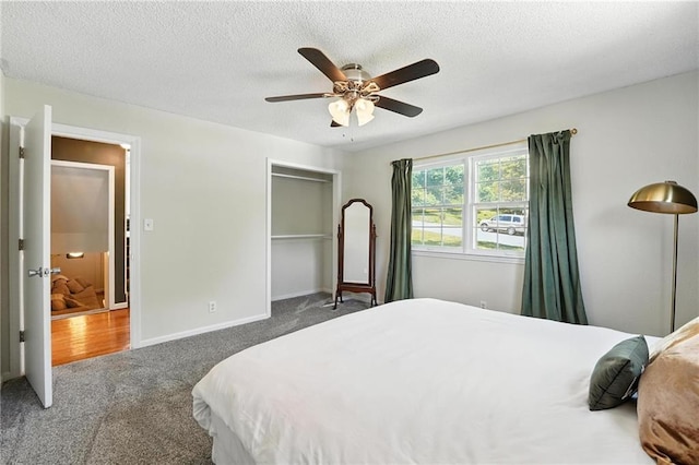 2903 E 107th Ter, Kansas City, MO 64137 - bedroom featuring carpet floors, a closet, ceiling fan, and a textured ceiling