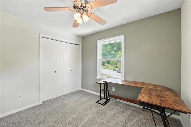 2903 E 107th Ter, Kansas City, MO 64137 - carpeted office space featuring baseboards and a ceiling fan