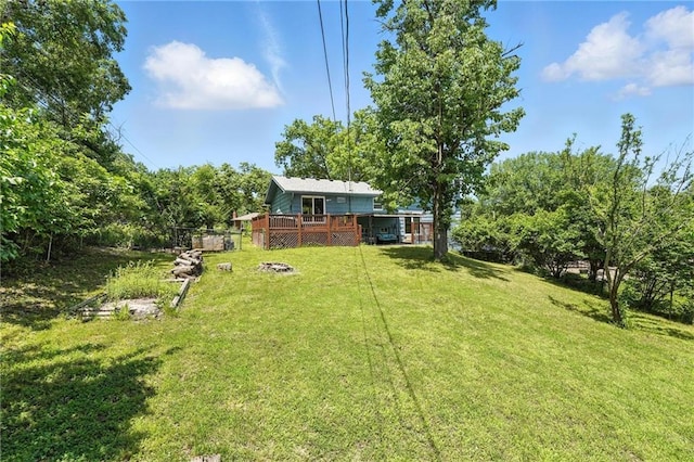 2903 E 107th Ter, Kansas City, MO 64137 - view of grassy yard with a wooden deck