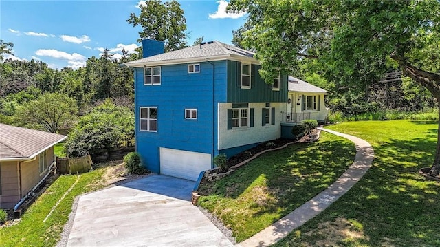 2903 E 107th Ter, Kansas City, MO 64137 - view of property exterior with driveway, an attached garage, a lawn, and a chimney