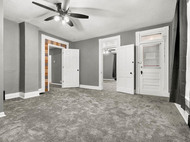 915 N 24th St, Saint Joseph, MO 64506 - unfurnished bedroom with carpet, a textured ceiling, and a ceiling fan