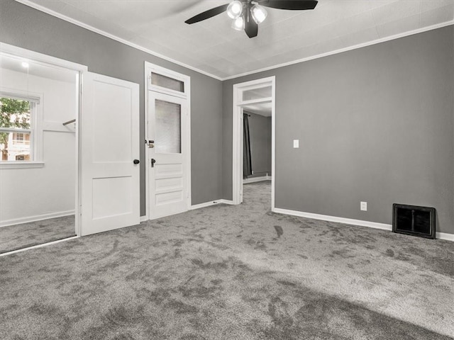 915 N 24th St, Saint Joseph, MO 64506 - unfurnished bedroom with ornamental molding, carpet floors, and a ceiling fan