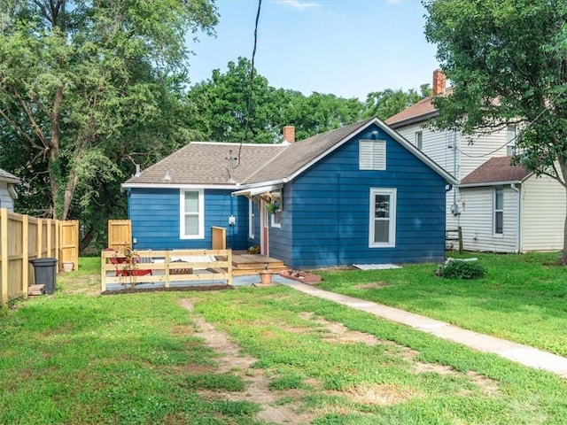 915 N 24th St, Saint Joseph, MO 64506 - bungalow featuring a chimney and roof with shingles