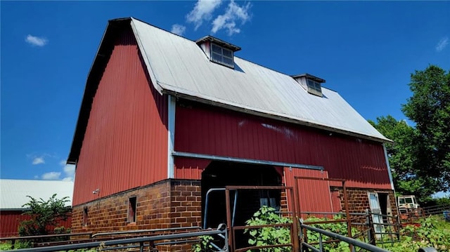 18400 Keitel Rd, Parker, KS 66072 - view of front facade featuring a barn, an outbuilding, a metal roof, and an exterior structure
