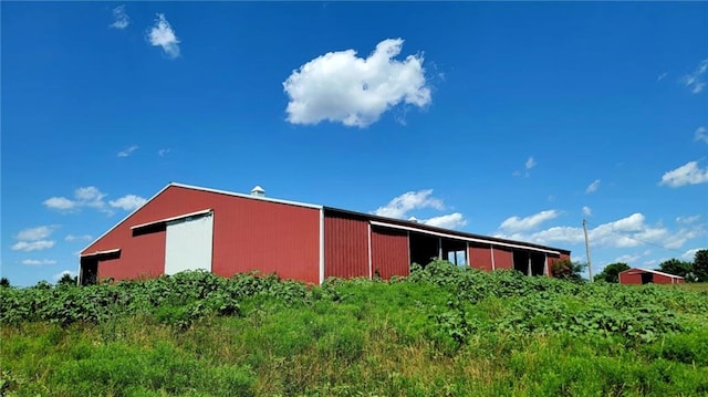 18400 Keitel Rd, Parker, KS 66072 - view of side of property with an outdoor structure and an outbuilding