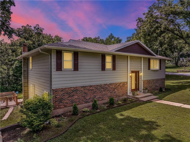 33383 Acorn Ln, Warsaw, MO 65355 - raised ranch featuring brick siding, a yard, and a chimney