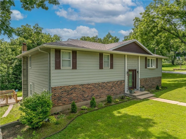 33383 Acorn Ln, Warsaw, MO 65355 - raised ranch with brick siding, a chimney, and a front yard