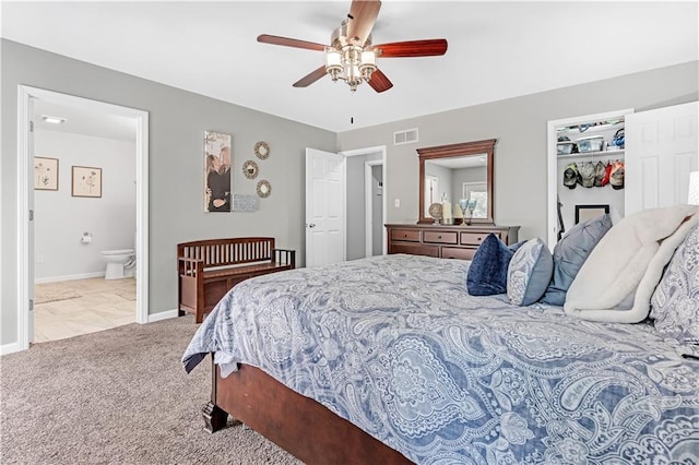 33383 Acorn Ln, Warsaw, MO 65355 - carpeted bedroom with connected bathroom and a ceiling fan
