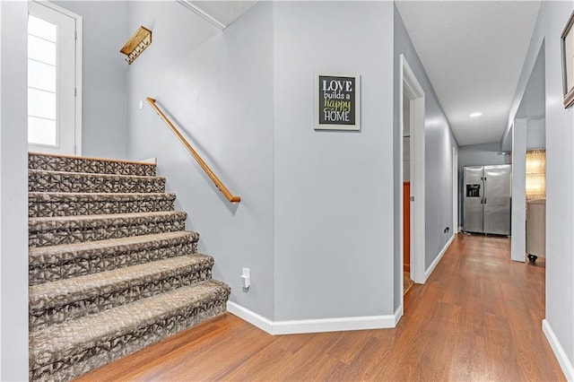33383 Acorn Ln, Warsaw, MO 65355 - stairway with wood finished floors and recessed lighting