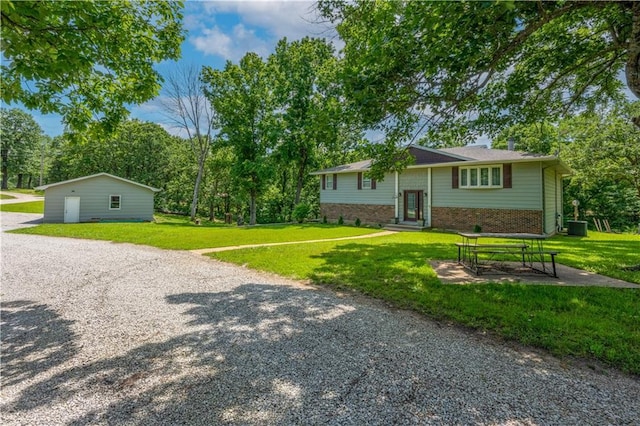 33383 Acorn Ln, Warsaw, MO 65355 - view of front facade featuring brick siding, a front yard, and entry steps