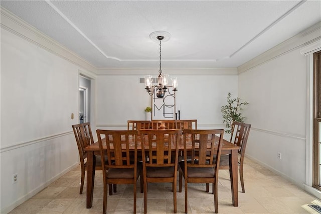 11530 Hemlock St, Overland Park, KS 66210 - dining room featuring a chandelier, a raised ceiling, and crown molding