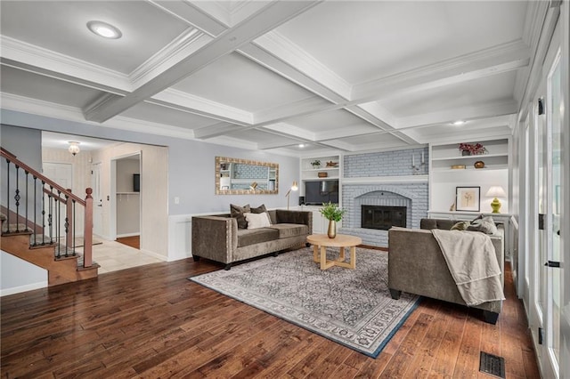 11530 Hemlock St, Overland Park, KS 66210 - living room with hardwood / wood-style floors, stairs, a fireplace, beam ceiling, and coffered ceiling