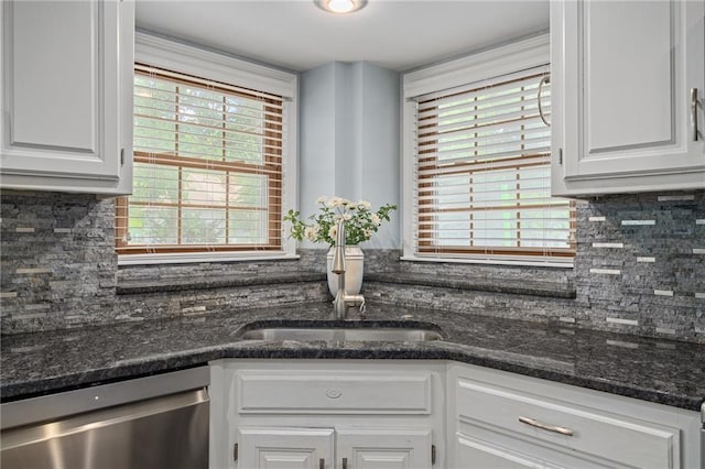 11530 Hemlock St, Overland Park, KS 66210 - kitchen featuring dishwasher, white cabinets, decorative backsplash, and dark stone countertops