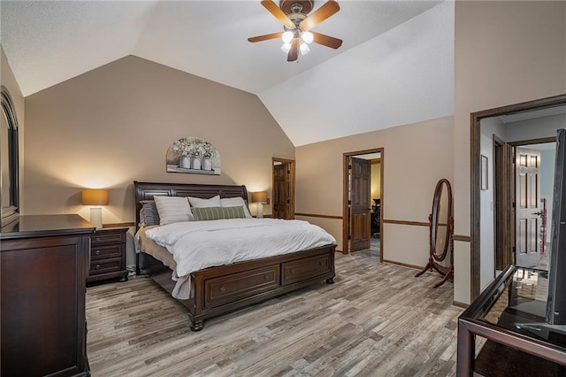 11530 Hemlock St, Overland Park, KS 66210 - bedroom with lofted ceiling, light wood-style flooring, and a ceiling fan