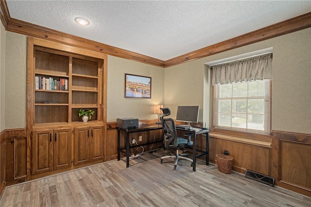 11530 Hemlock St, Overland Park, KS 66210 - office with a textured ceiling, ornamental molding, light wood-type flooring, wainscoting, and wooden walls