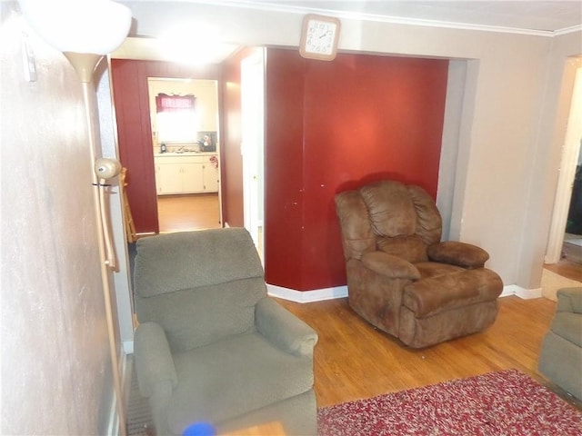 482 Fieldcrest Dr, Pittsburg, KS 66762 - living area with wood finished floors and ornamental molding