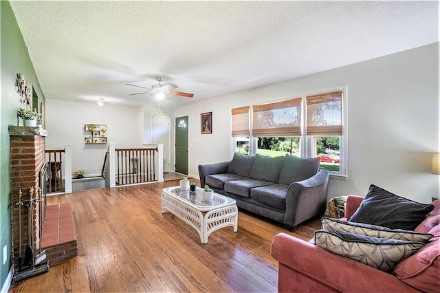 2110 N 70th Ter, Kansas City, KS 66109 - living room with ceiling fan, wood finished floors, and a textured ceiling