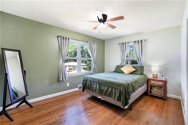 2110 N 70th Ter, Kansas City, KS 66109 - bedroom featuring wood finished floors and a ceiling fan