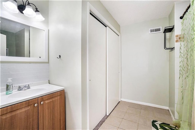 2110 N 70th Ter, Kansas City, KS 66109 - full bath featuring vanity, tile patterned floors, and curtained shower