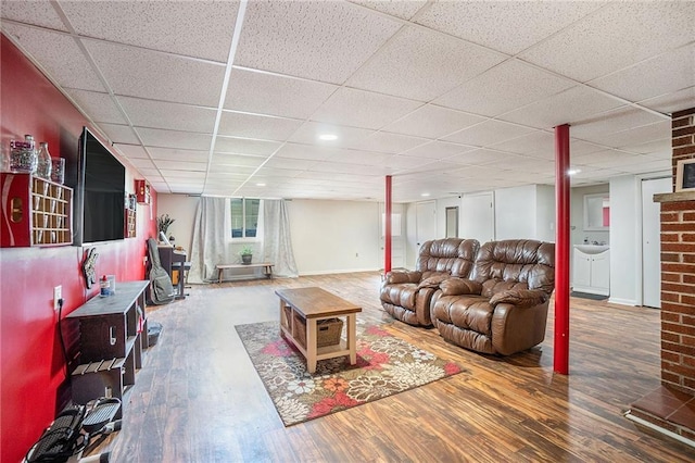 2110 N 70th Ter, Kansas City, KS 66109 - living area featuring wood finished floors and a paneled ceiling