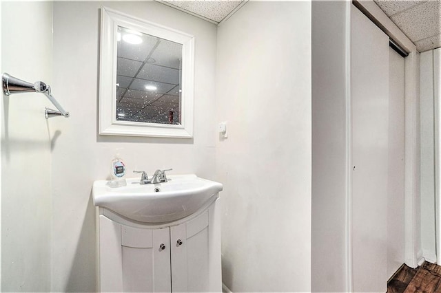 2110 N 70th Ter, Kansas City, KS 66109 - bathroom featuring a paneled ceiling and vanity