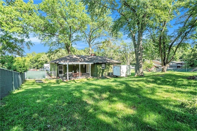 2110 N 70th Ter, Kansas City, KS 66109 - rear view of house featuring a fenced backyard and a chimney