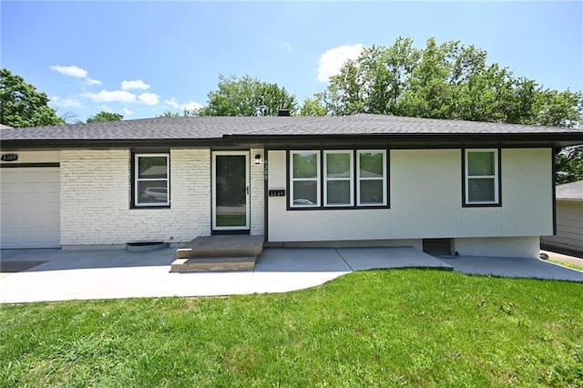 6309 E 102nd Ter, Kansas City, MO 64134 - single story home featuring a front yard, a shingled roof, an attached garage, and brick siding