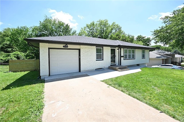 6309 E 102nd Ter, Kansas City, MO 64134 - single story home with a garage, driveway, and brick siding