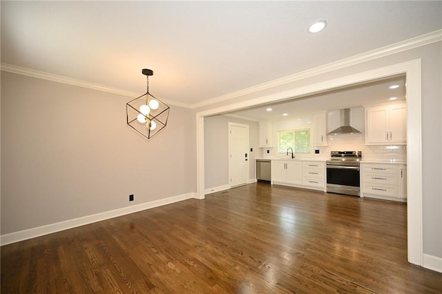 6309 E 102nd Ter, Kansas City, MO 64134 - unfurnished living room featuring dark wood finished floors, crown molding, and recessed lighting