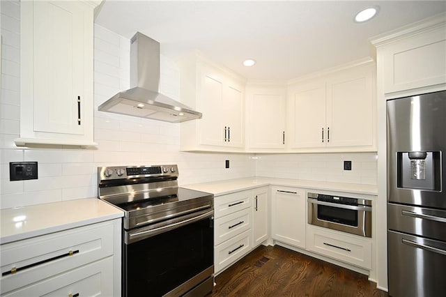 6309 E 102nd Ter, Kansas City, MO 64134 - kitchen with appliances with stainless steel finishes, wall chimney range hood, light countertops, backsplash, and recessed lighting