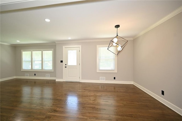6309 E 102nd Ter, Kansas City, MO 64134 - entryway featuring ornamental molding, dark wood-style flooring, and recessed lighting