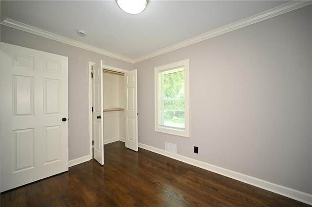 6309 E 102nd Ter, Kansas City, MO 64134 - unfurnished bedroom with dark wood-style floors, crown molding, and a closet