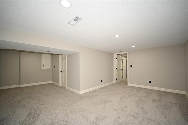 6309 E 102nd Ter, Kansas City, MO 64134 - below grade area featuring light carpet and recessed lighting