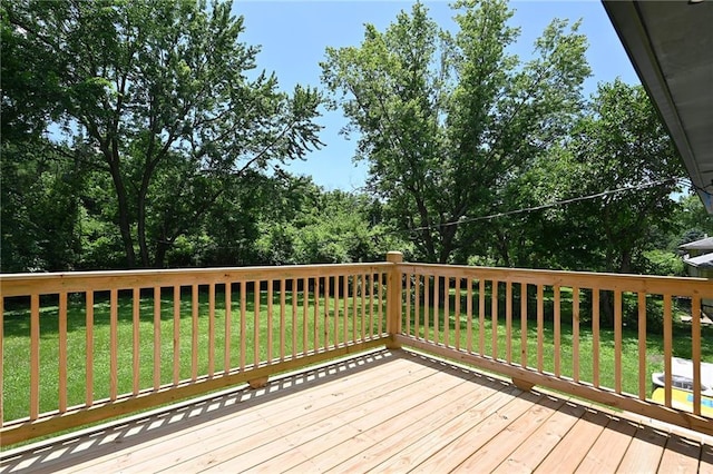 6309 E 102nd Ter, Kansas City, MO 64134 - wooden terrace featuring a yard and view of wooded area
