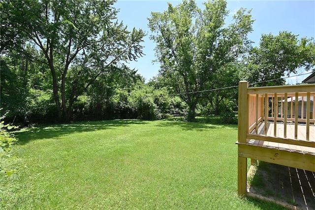 6309 E 102nd Ter, Kansas City, MO 64134 - view of grassy yard with a deck
