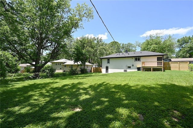 6309 E 102nd Ter, Kansas City, MO 64134 - back of house with a wooden deck