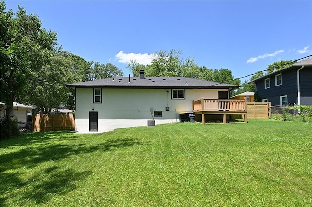 6309 E 102nd Ter, Kansas City, MO 64134 - back of house with a wooden deck