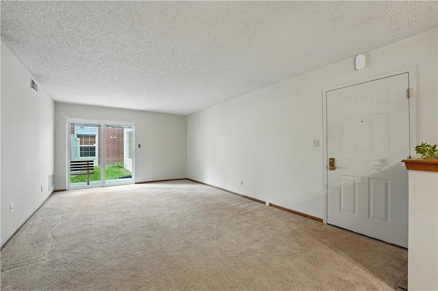 8001 Westridge Rd Unit 103, Raytown, MO 64138 - carpeted empty room with a textured ceiling