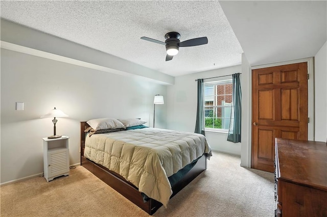 8001 Westridge Rd Unit 103, Raytown, MO 64138 - bedroom featuring light carpet, a textured ceiling, and ceiling fan