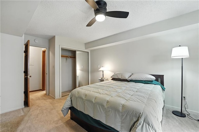 8001 Westridge Rd Unit 103, Raytown, MO 64138 - bedroom featuring light carpet, a closet, a textured ceiling, and ceiling fan