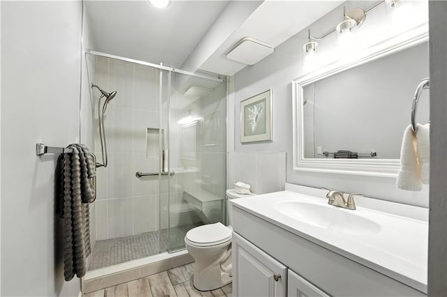 8001 Westridge Rd Unit 103, Raytown, MO 64138 - bathroom featuring vanity, a stall shower, and wood finished floors