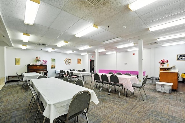 8001 Westridge Rd Unit 103, Raytown, MO 64138 - dining room featuring carpet flooring and a paneled ceiling