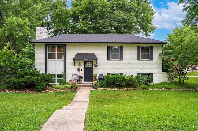 16722 E 35th Ter, Independence, MO 64055 - raised ranch with a chimney, brick siding, and a front yard