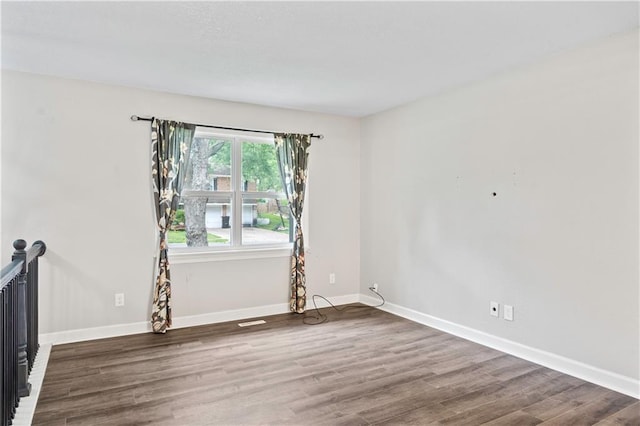 16722 E 35th Ter, Independence, MO 64055 - unfurnished room with wood finished floors and baseboards