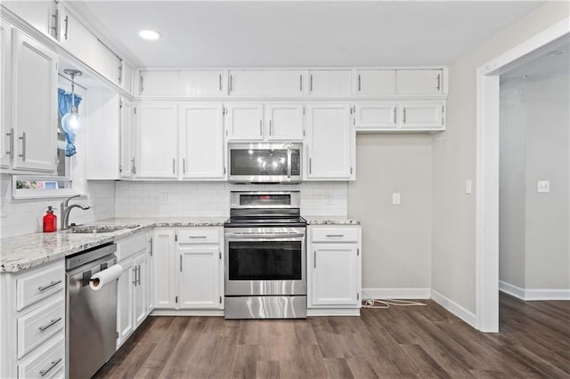 16722 E 35th Ter, Independence, MO 64055 - kitchen featuring stainless steel appliances, white cabinetry, dark wood-style floors, and recessed lighting