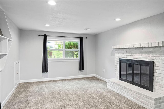 16722 E 35th Ter, Independence, MO 64055 - unfurnished living room with carpet floors, recessed lighting, and a fireplace