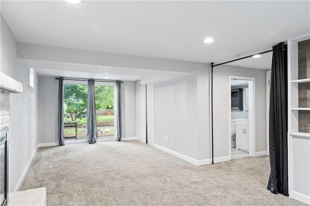 16722 E 35th Ter, Independence, MO 64055 - unfurnished living room featuring carpet, recessed lighting, and a fireplace