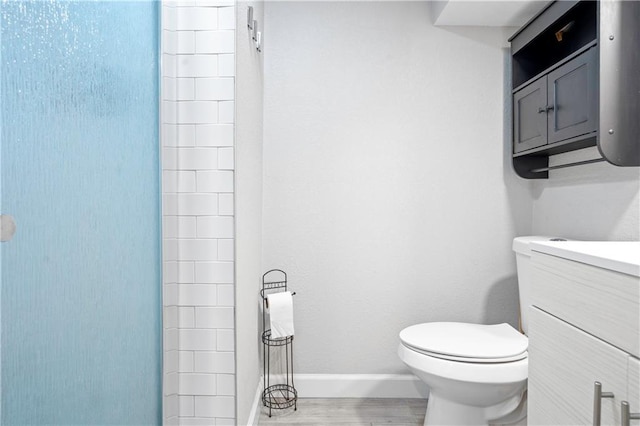 16722 E 35th Ter, Independence, MO 64055 - bathroom featuring vanity, wood finished floors, and a shower