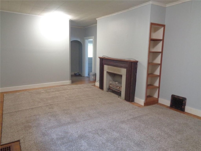 1918 S Elm St, Pittsburg, KS 66762 - unfurnished living room with ornamental molding, arched walkways, carpet, and a fireplace